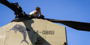 Rear rotor check Man repairing helicopter